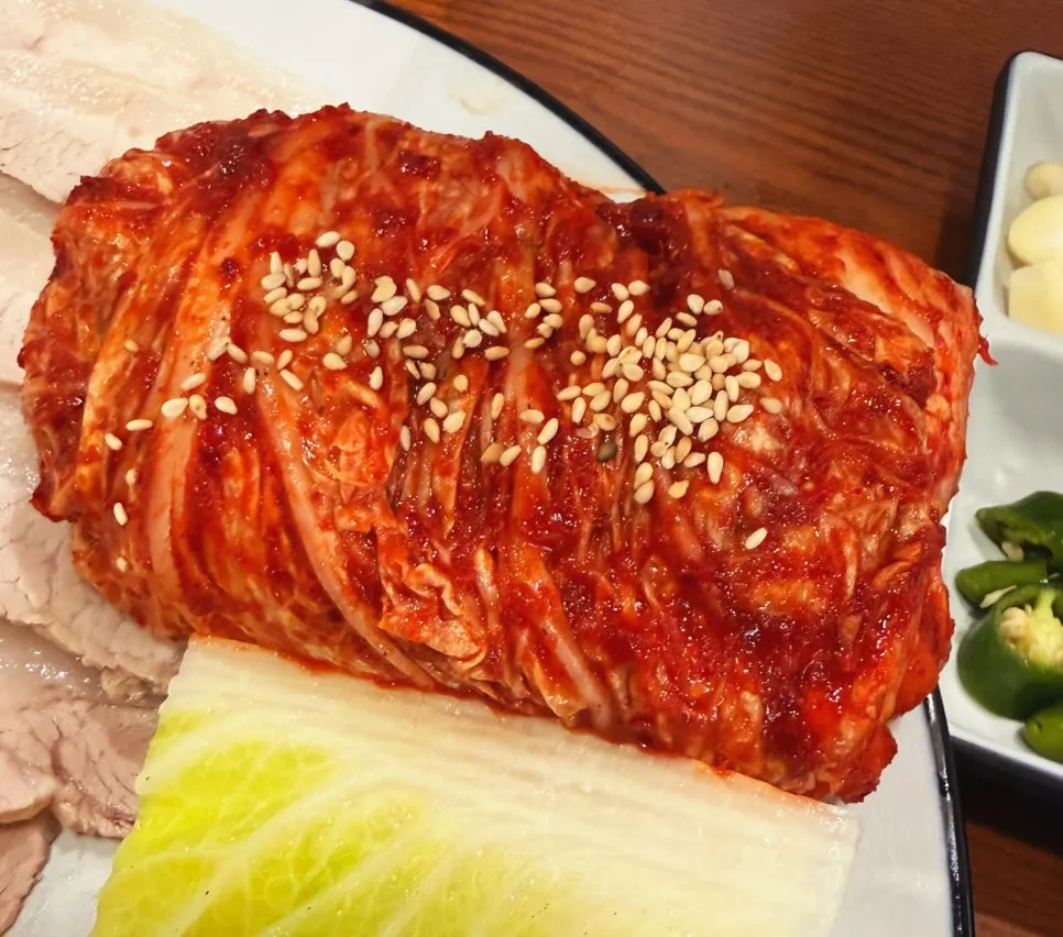 Neatly rolled cabbage kimchi and steamed cabbage
