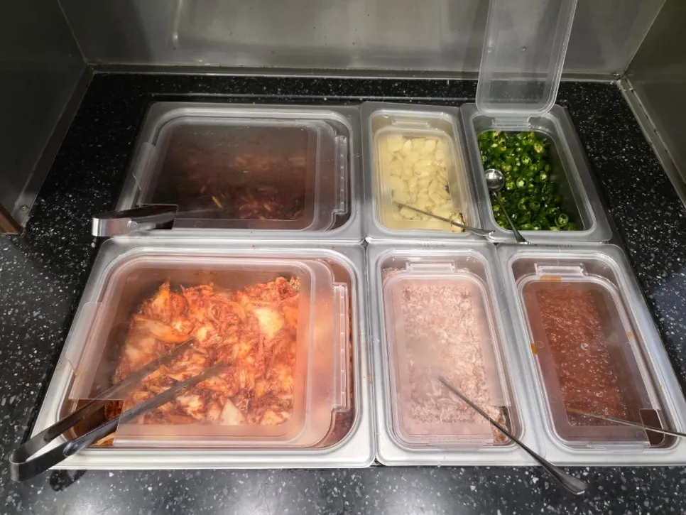 Garlic, cheongyang chili, ssamjang, and salted shrimp served with bossam
