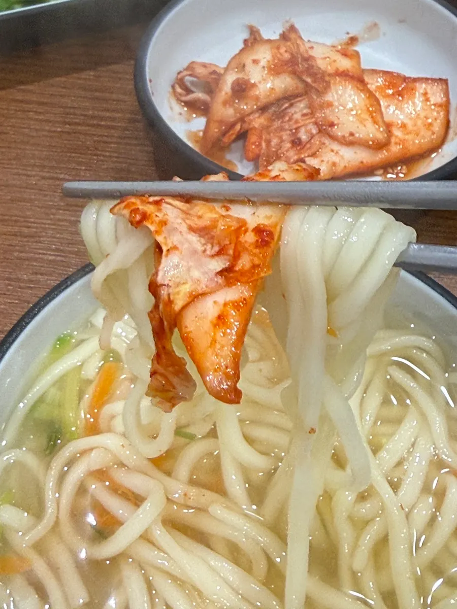 Kalguksu boiling in seafood broth