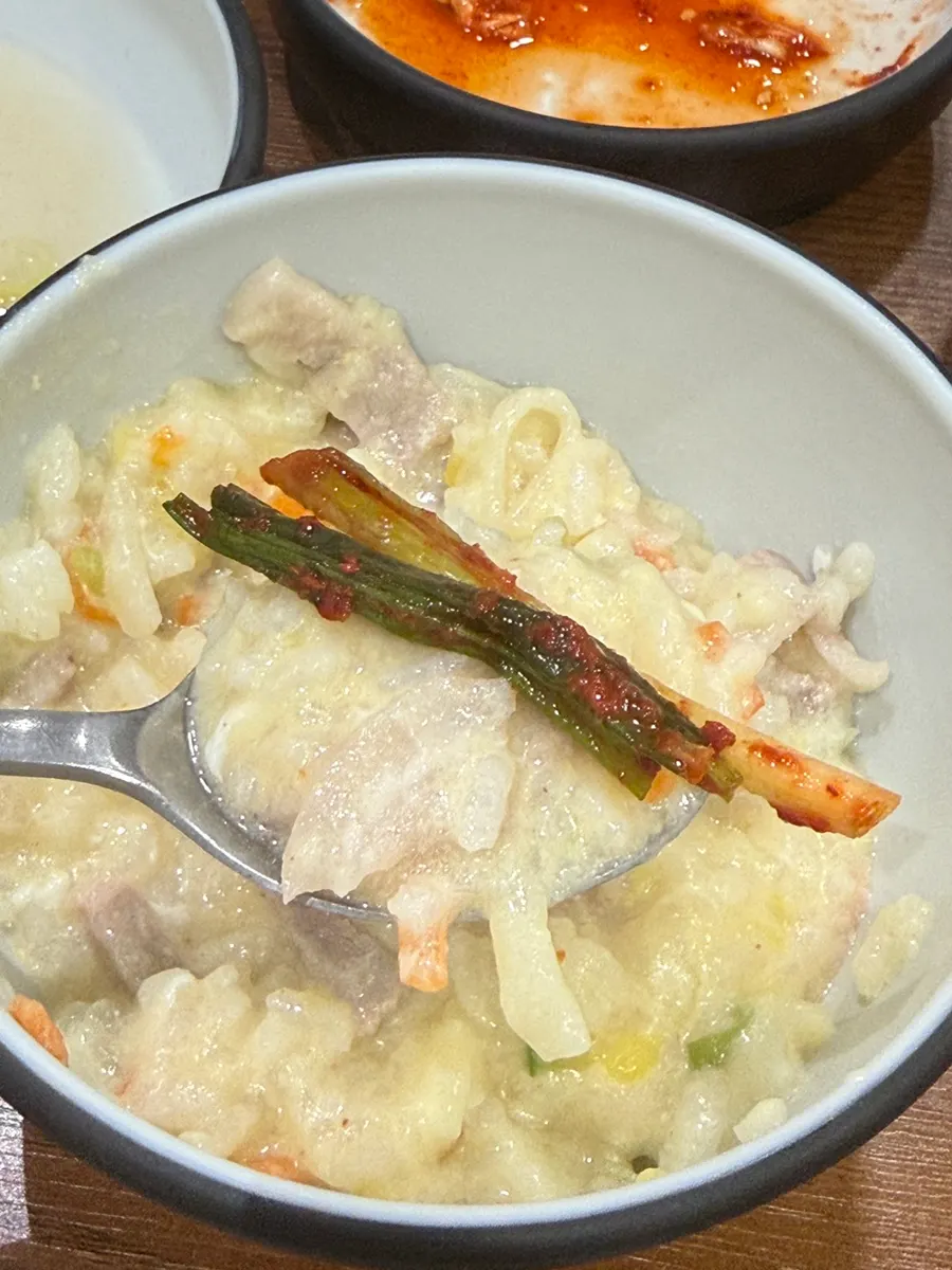 Porridge made with leftover broth, rice, and raw egg