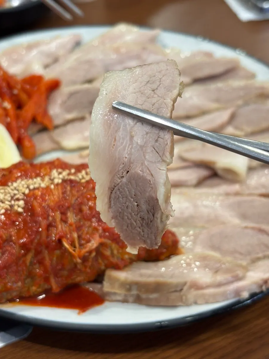 Gabrisal boiled pork placed on a cabbage wrap