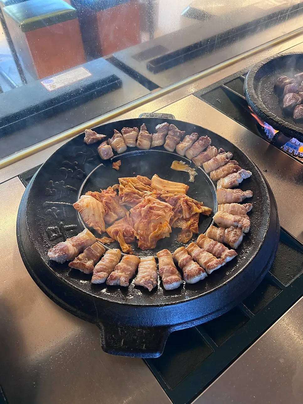 Grilled meat plating on a cast-iron grill