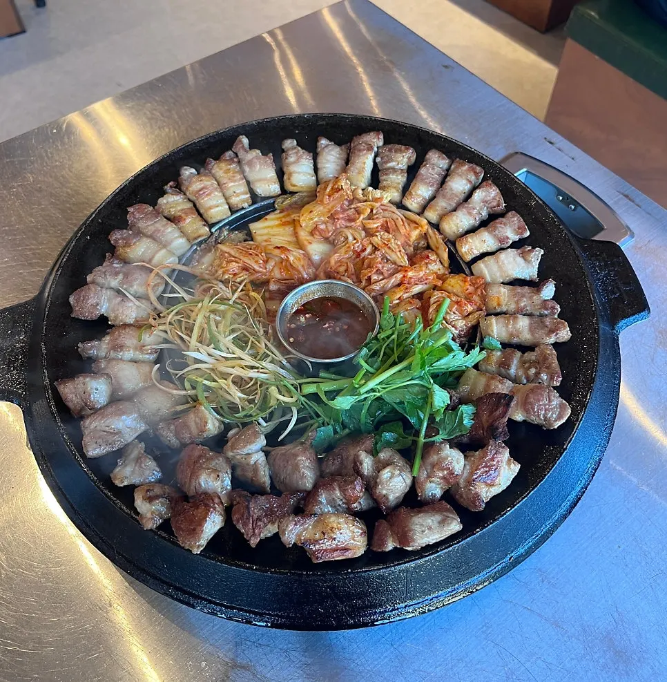 Custom-made cast-iron grill with spaces for kimchi and pa-jeori