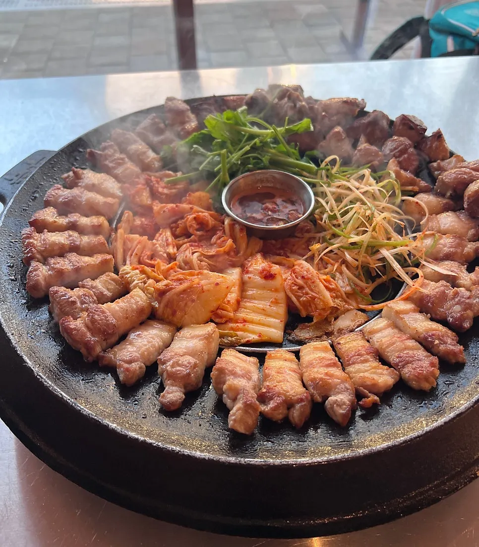 Cast-iron pot holding meat cooked at its most delicious point