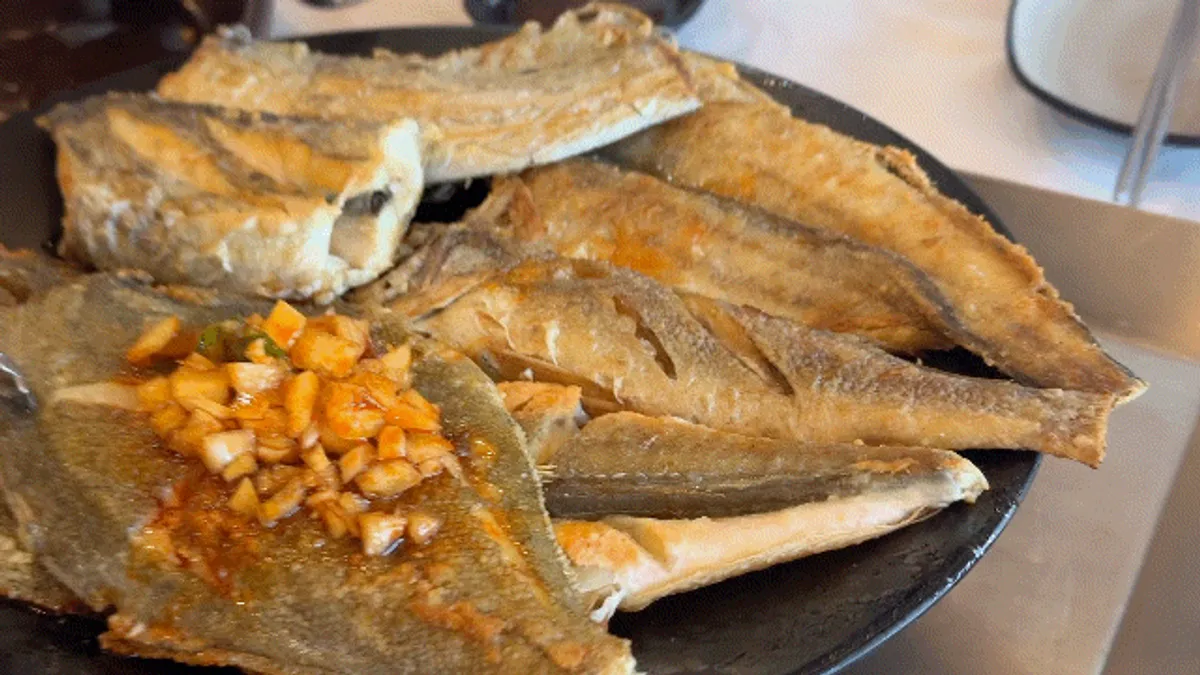 Grilled fish lineup of croaker gulbi, flounder, deep-sea cod, gurnard, and cutlassfish