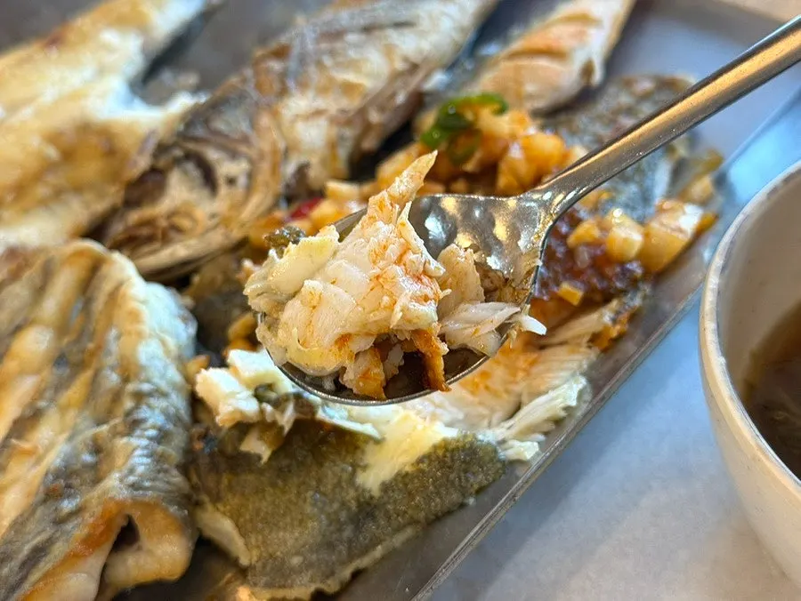 Seasonal grilled fish with the flesh picked out
