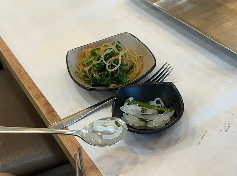 Plate of banchan topped up from the self-serve bar