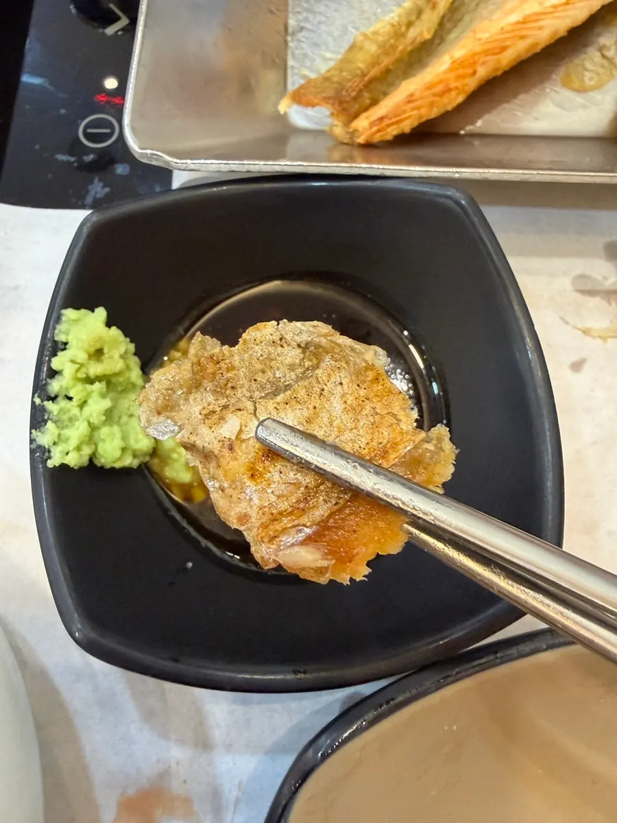 Fish flesh wrapped in a lettuce leaf
