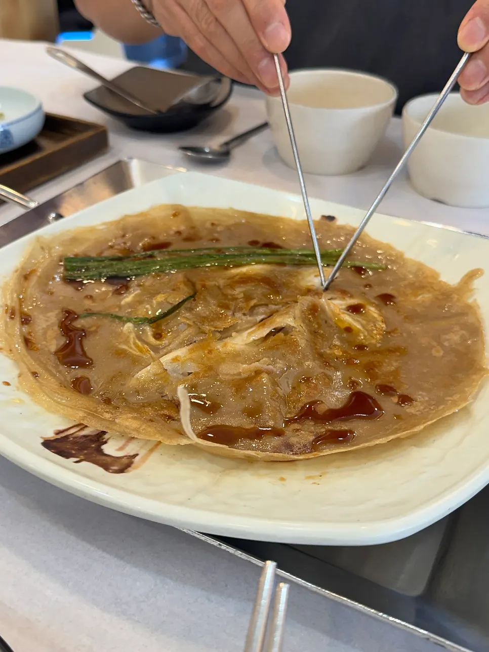 Cabbage buckwheat pancake served alongside the grilled fish