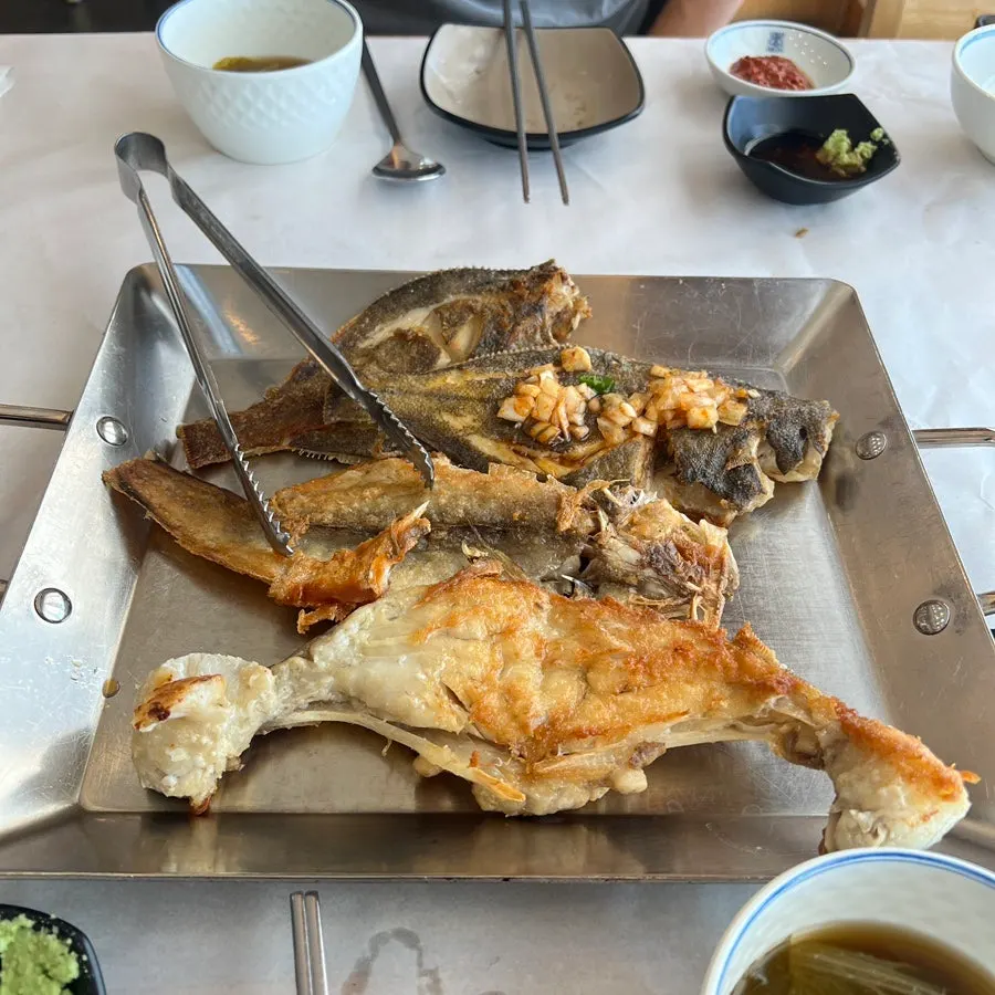 Plate of grilled flounder, bottom cod, and cod cheek