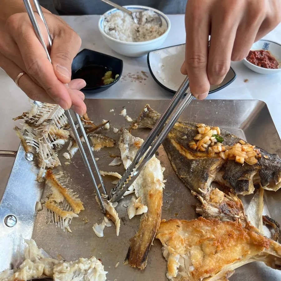 Plate with a portion of grilled fish removed