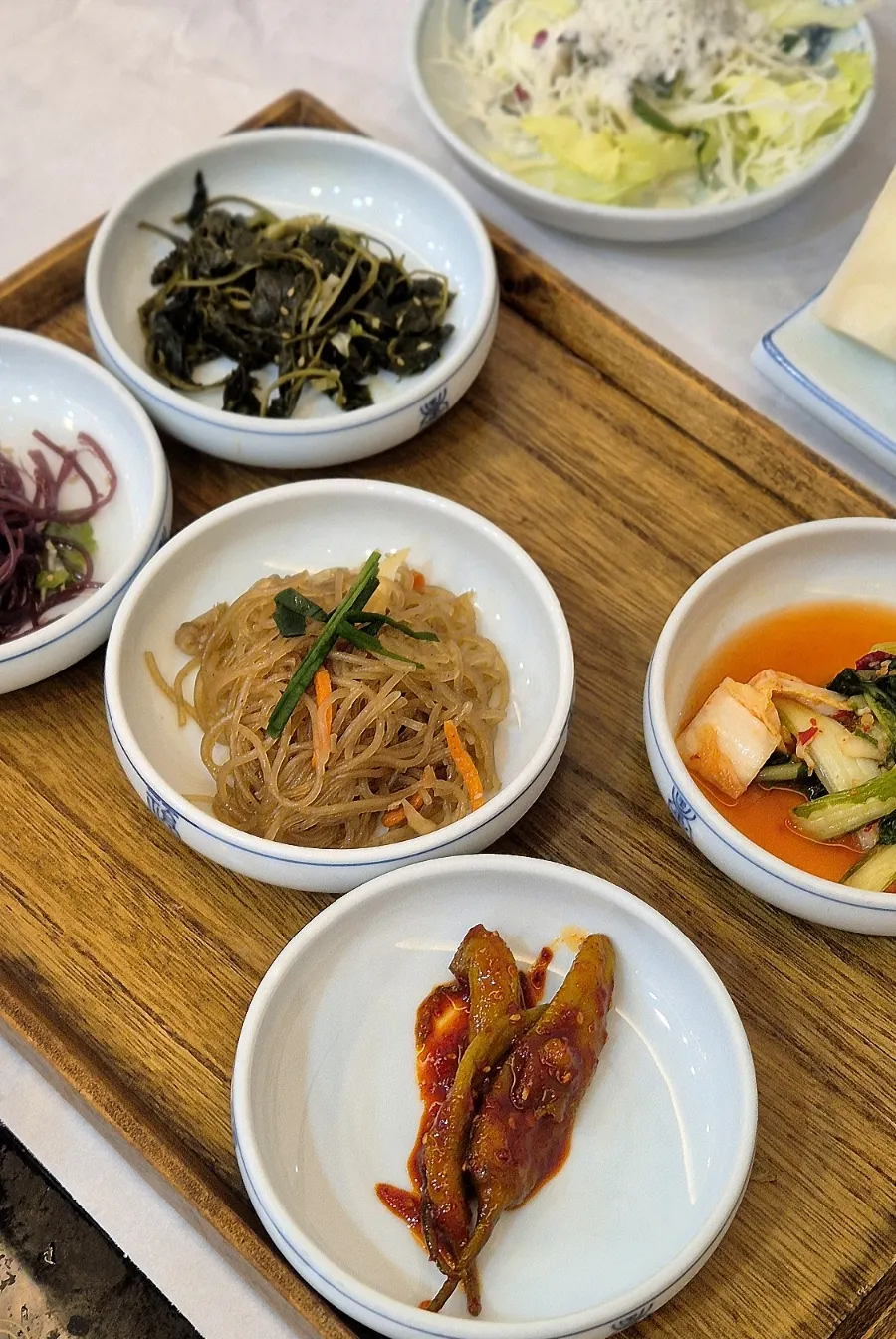 Glass noodle japchae and spicy seasoned pepper banchan