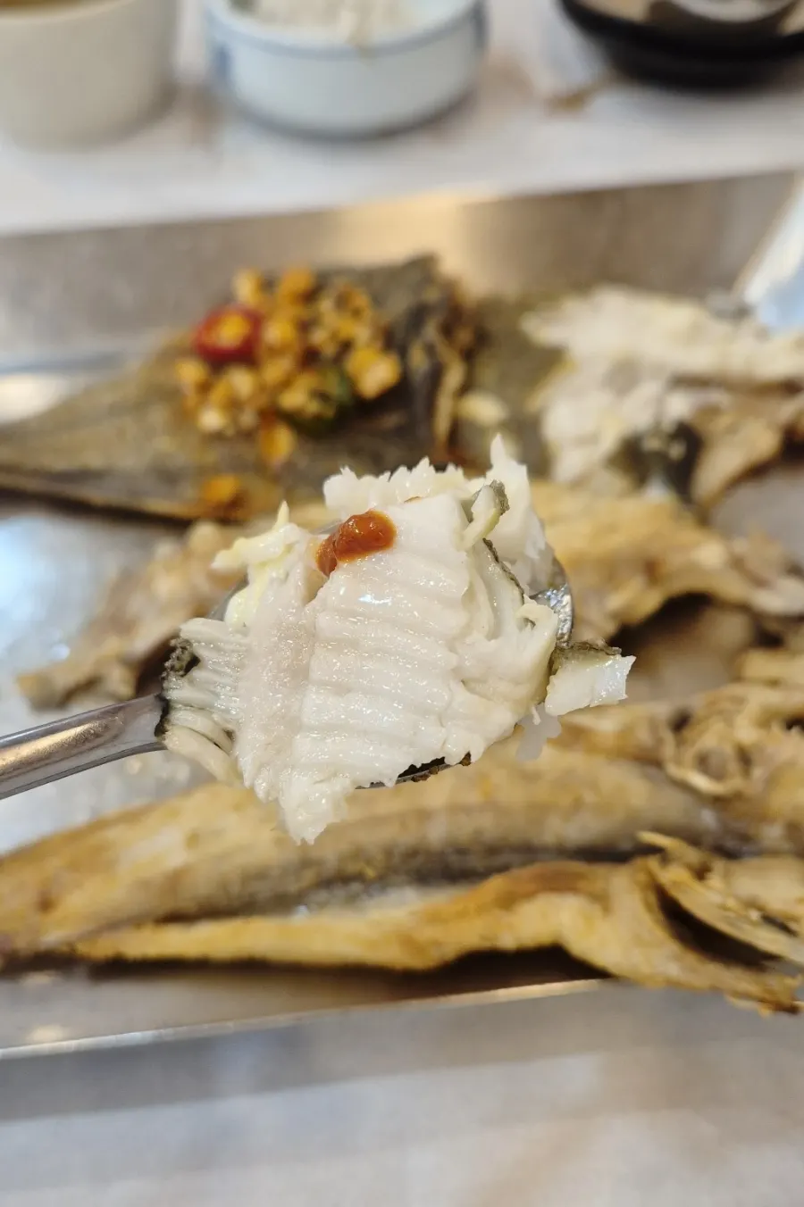 Three types of grilled fish — mackerel, pollock cod, and flounder