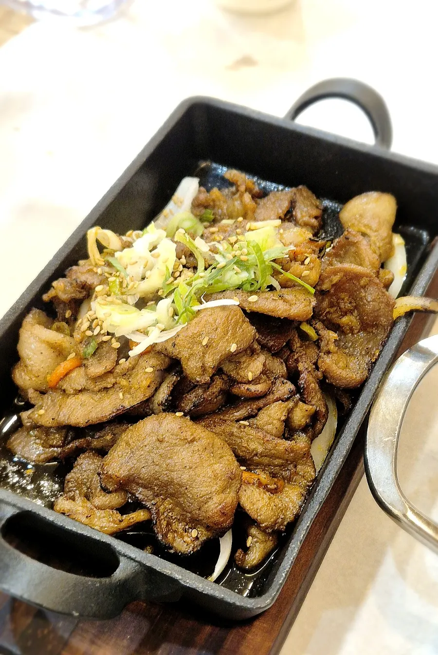 Korean meal spread with grilled fish and bulgogi
