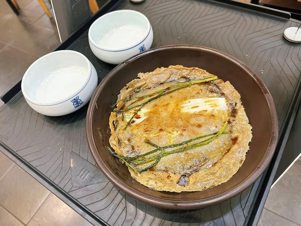 Banchan set out in ceramic dishes
