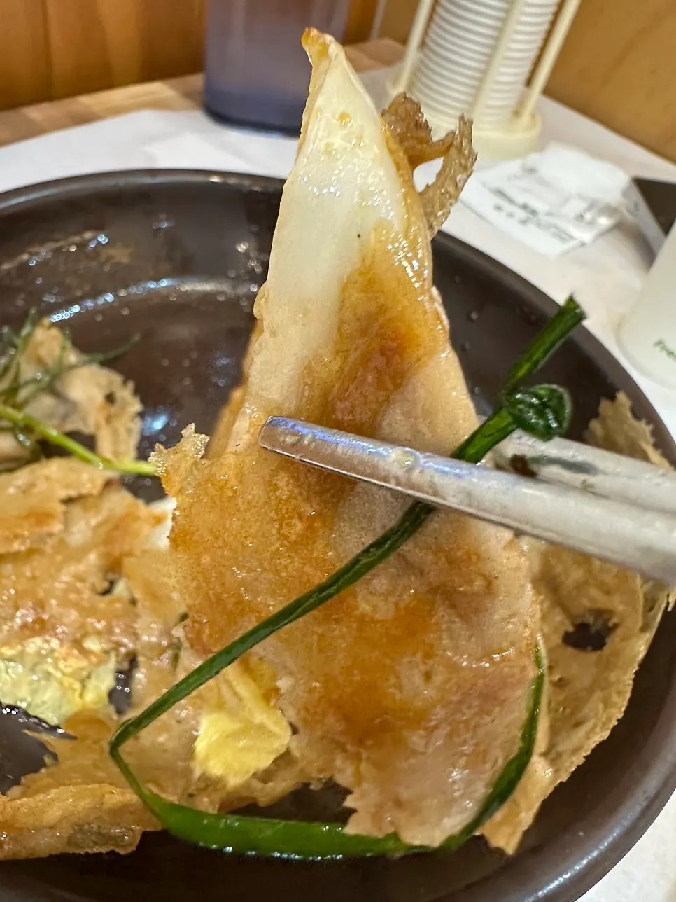 Buckwheat cabbage pancake dipped in soy sauce