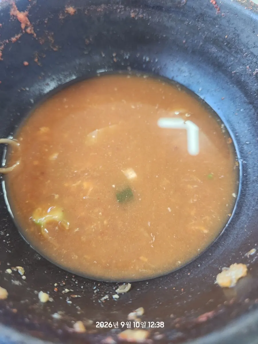 Ttukbaegi with scallops, shrimp, and blue crab