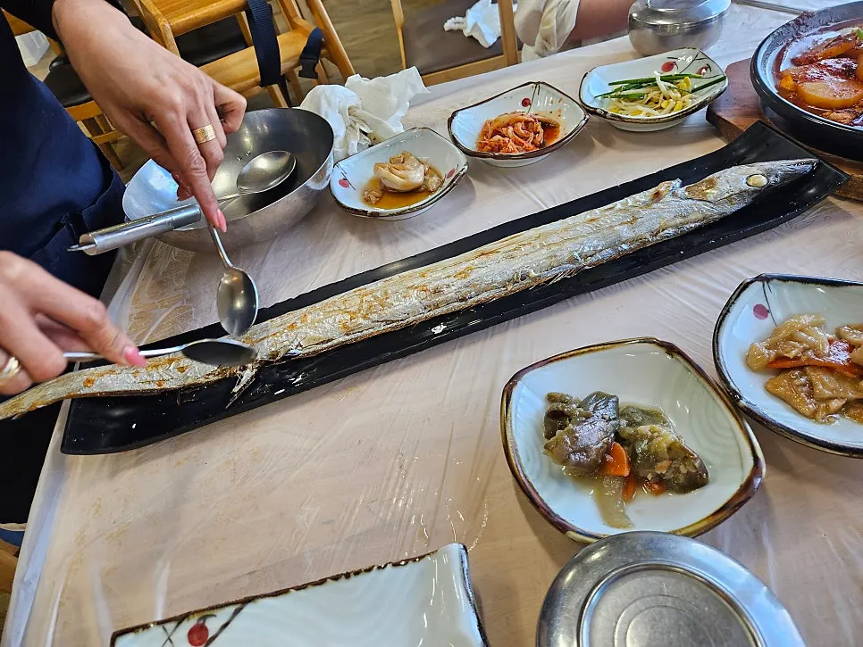 Window-side seating and outside view at Seongsan Bada Punggyeong