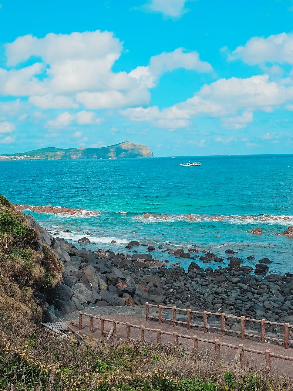 View of the Seongsan sea while holding a coffee