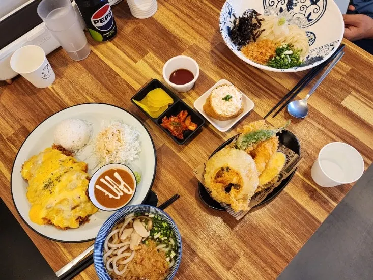 Meal setting with yellow pickled radish and kimchi