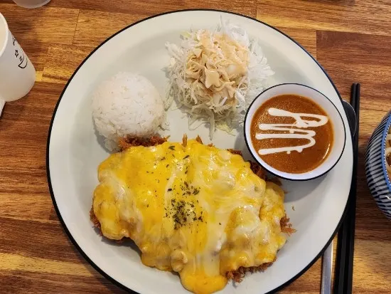Pork loin cutlet topped with cheese