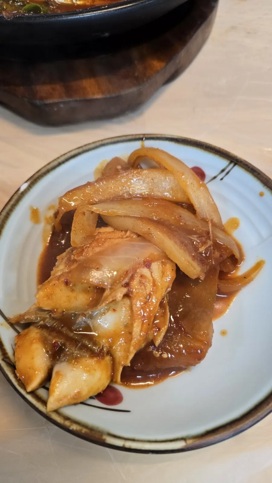 Bada Punggyeong Braise being topped with broth