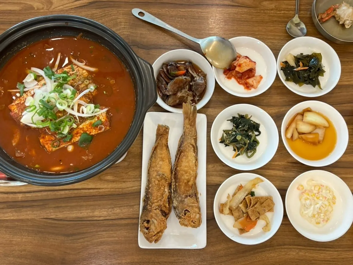 A set table spread with braised hairtail and side dishes