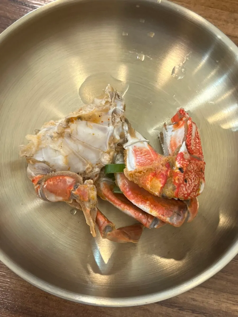 Close-up of the seafood stew broth and seafood