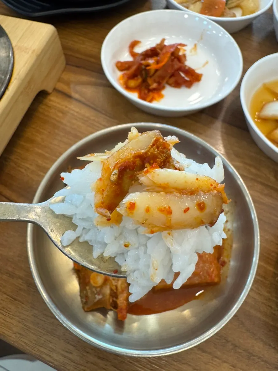 Large chunks of sauce-soaked radish inside the braised hairtail