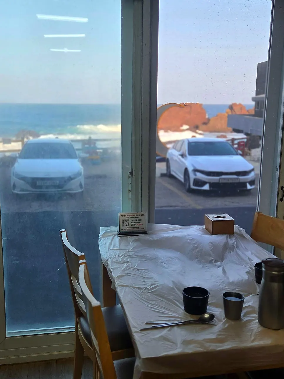 Dining table with a view of the Seongsan sea