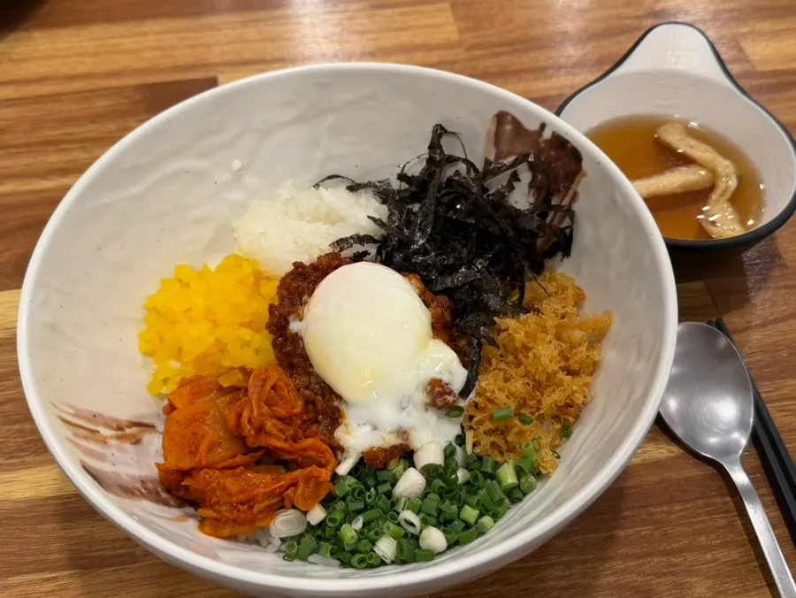 Minced pork rice bowl topped with a poached egg