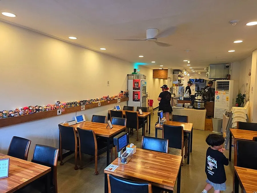 Dining hall view with open kitchen visible