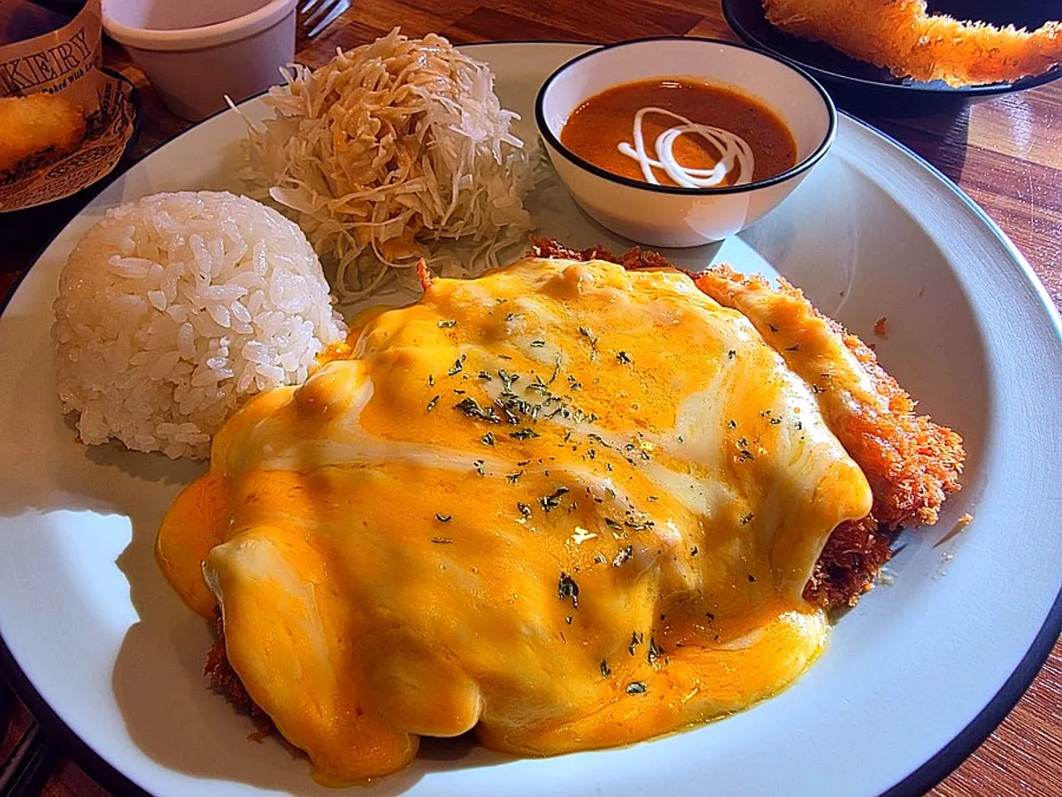 Cheese pork cutlet served with rice