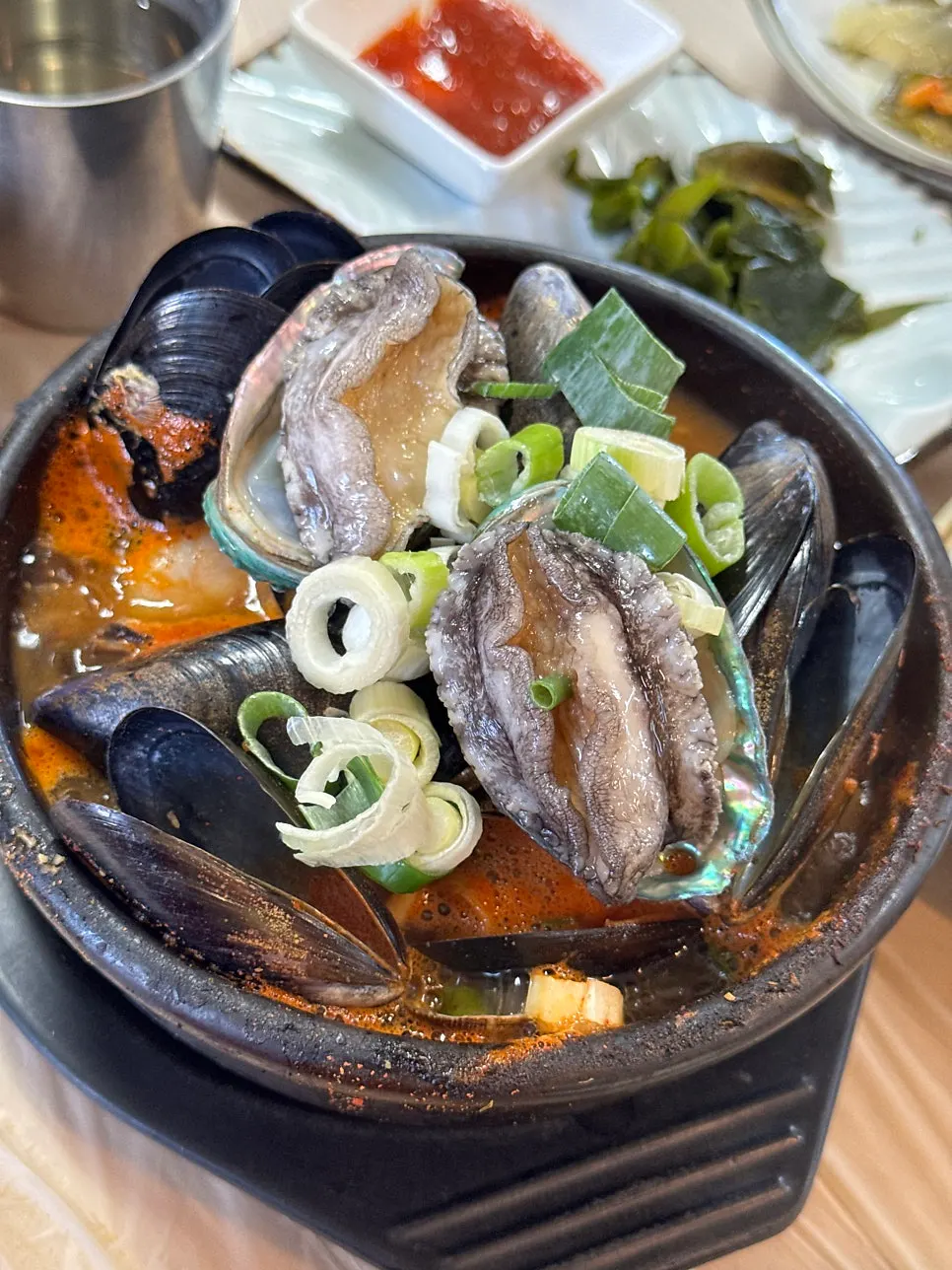 Seafood stew bubbling at Seongsan Bada Punggyeong