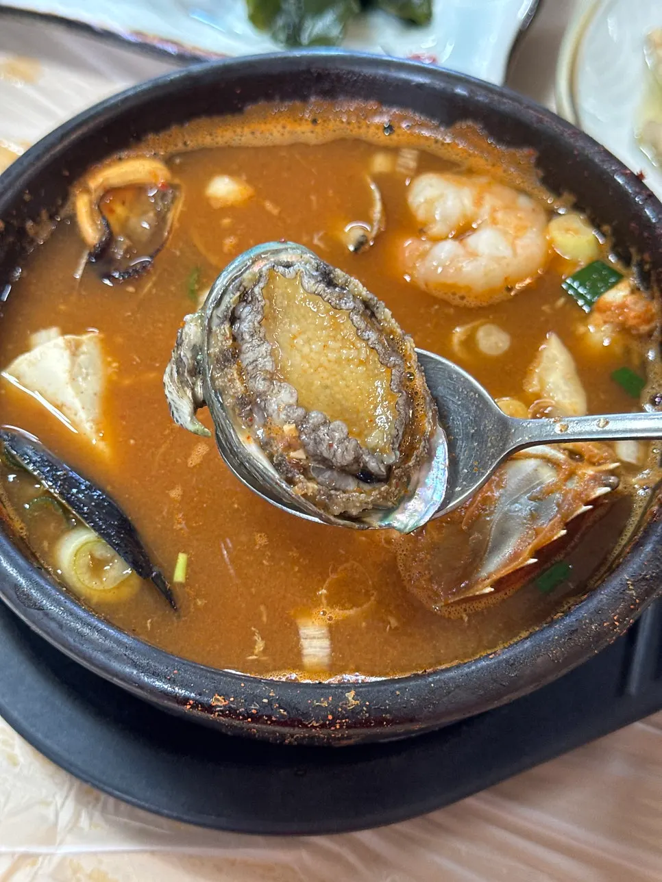 Seafood stew filled with abalone, scallops, sweet shrimp and blue crab