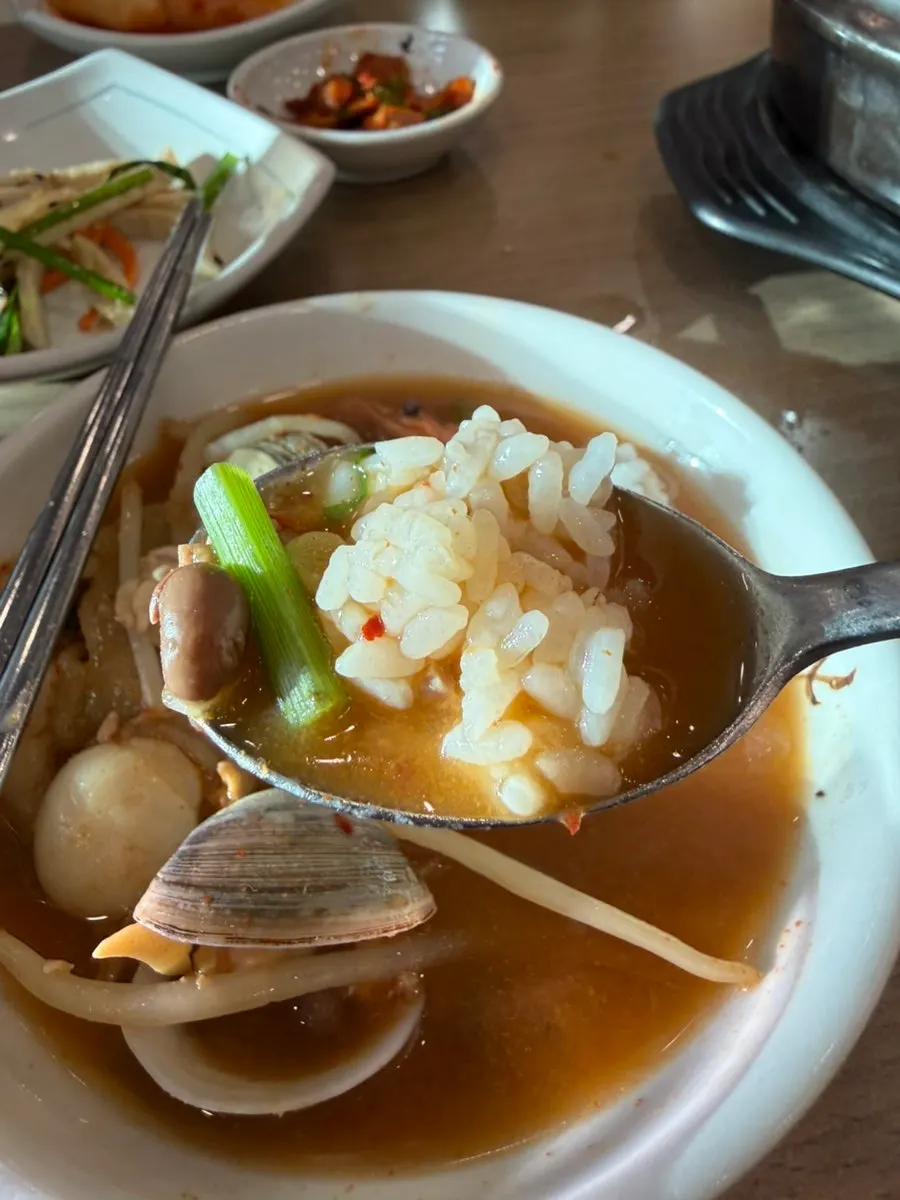 A spoonful of rice soaked in the cheonggukjang broth