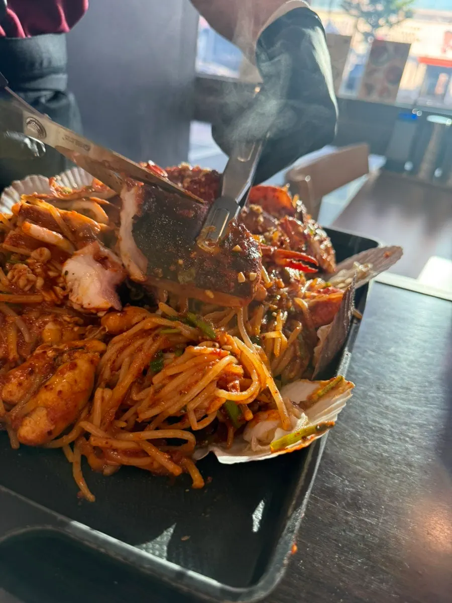 Bean sprouts mixed with sauce in the seafood boil