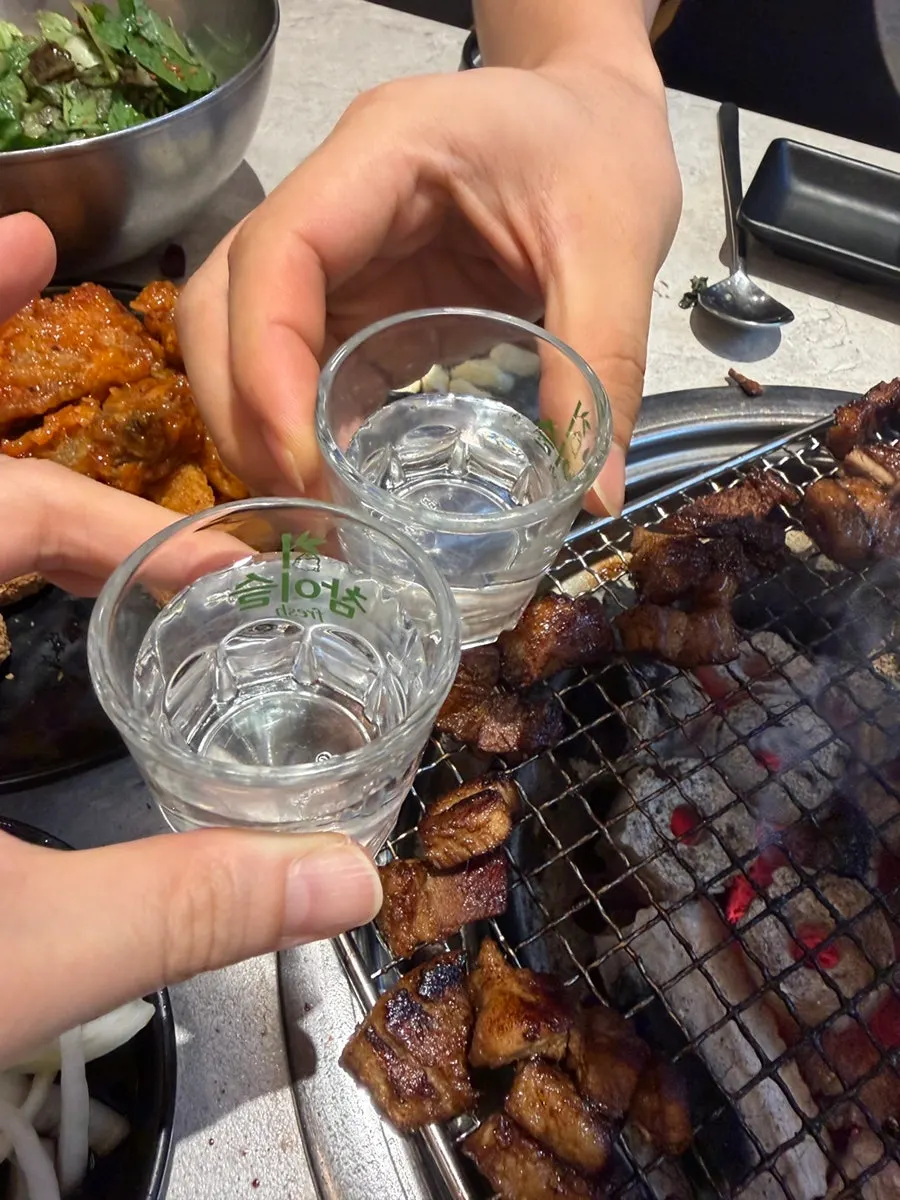 A spread of ribs, chicken, tteokbokki and fried foods