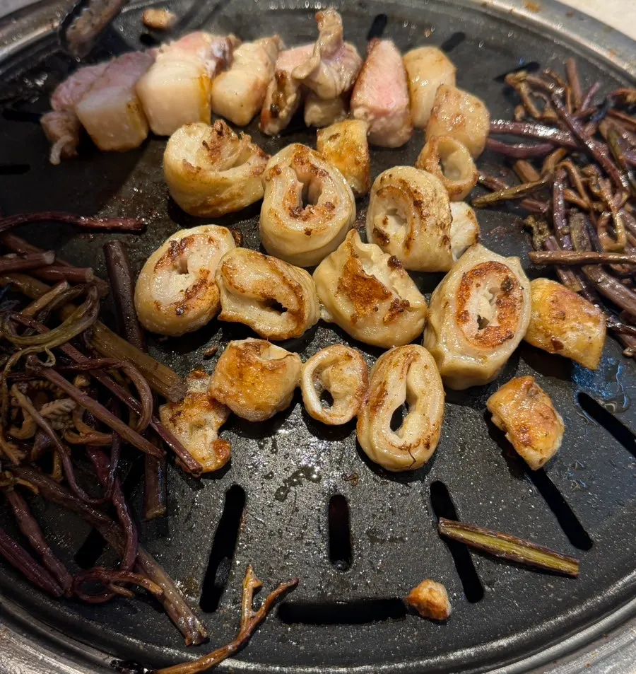 Makchang and pork belly grilling on the grill
