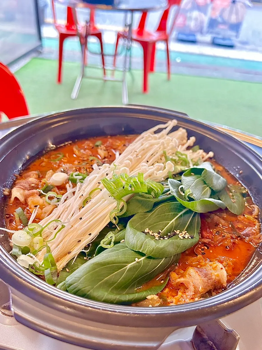 Hot pot with tendon, beef brisket and enoki mushrooms