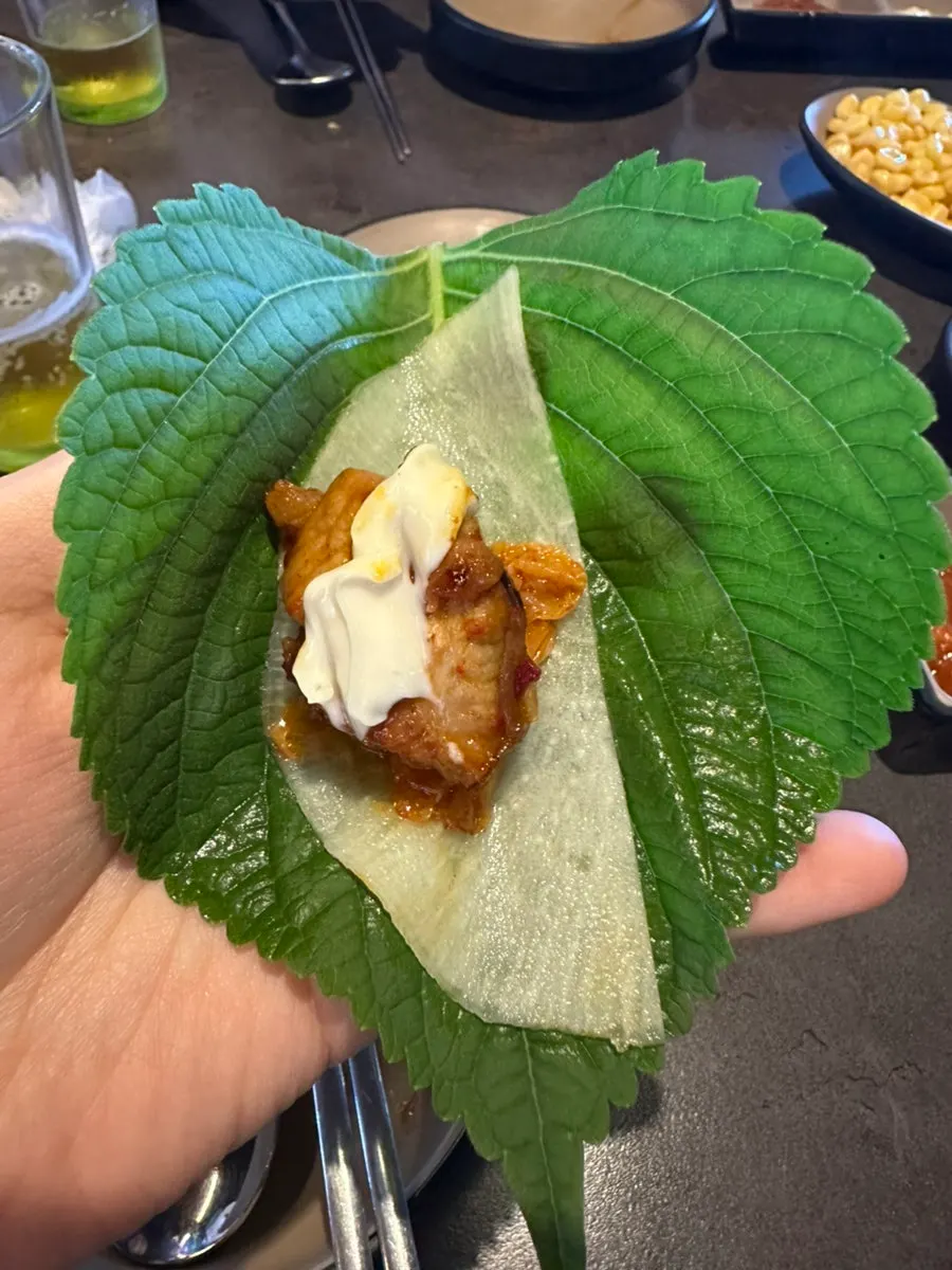 A perilla leaf wrap packed with ingredients