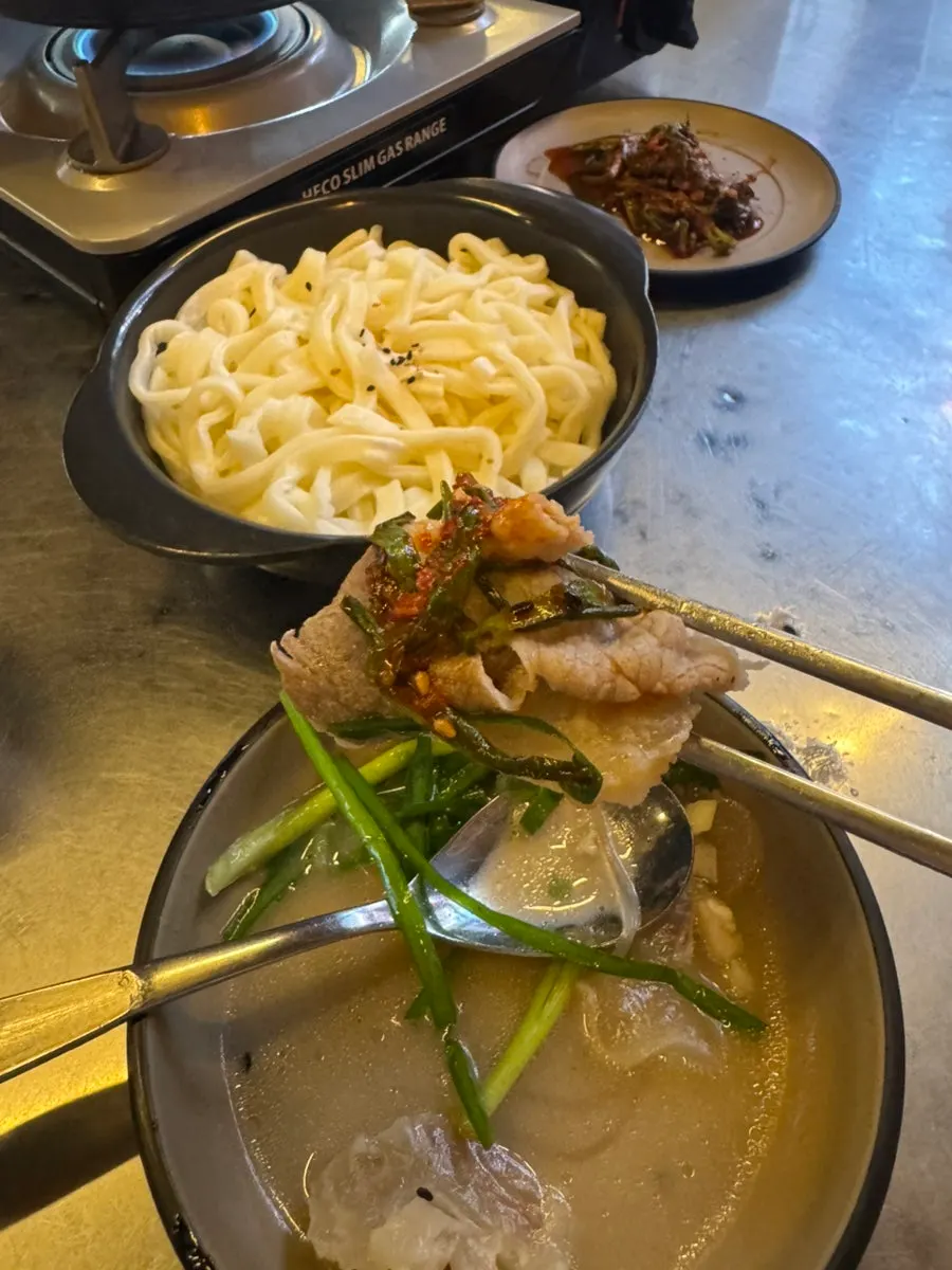 Hot pot ingredients topped with chive kimchi