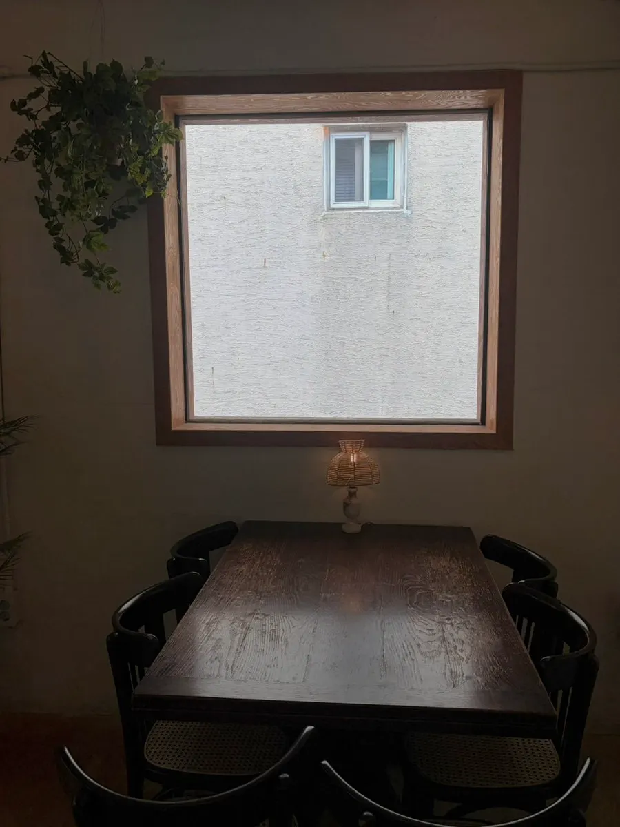 Indoor seating with a picture window at 5to7