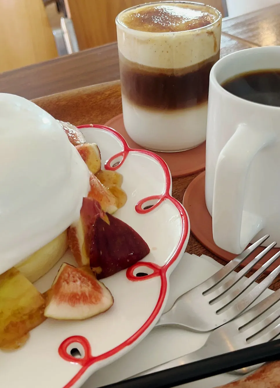 Close-up of the soufflé topped with figs and cream