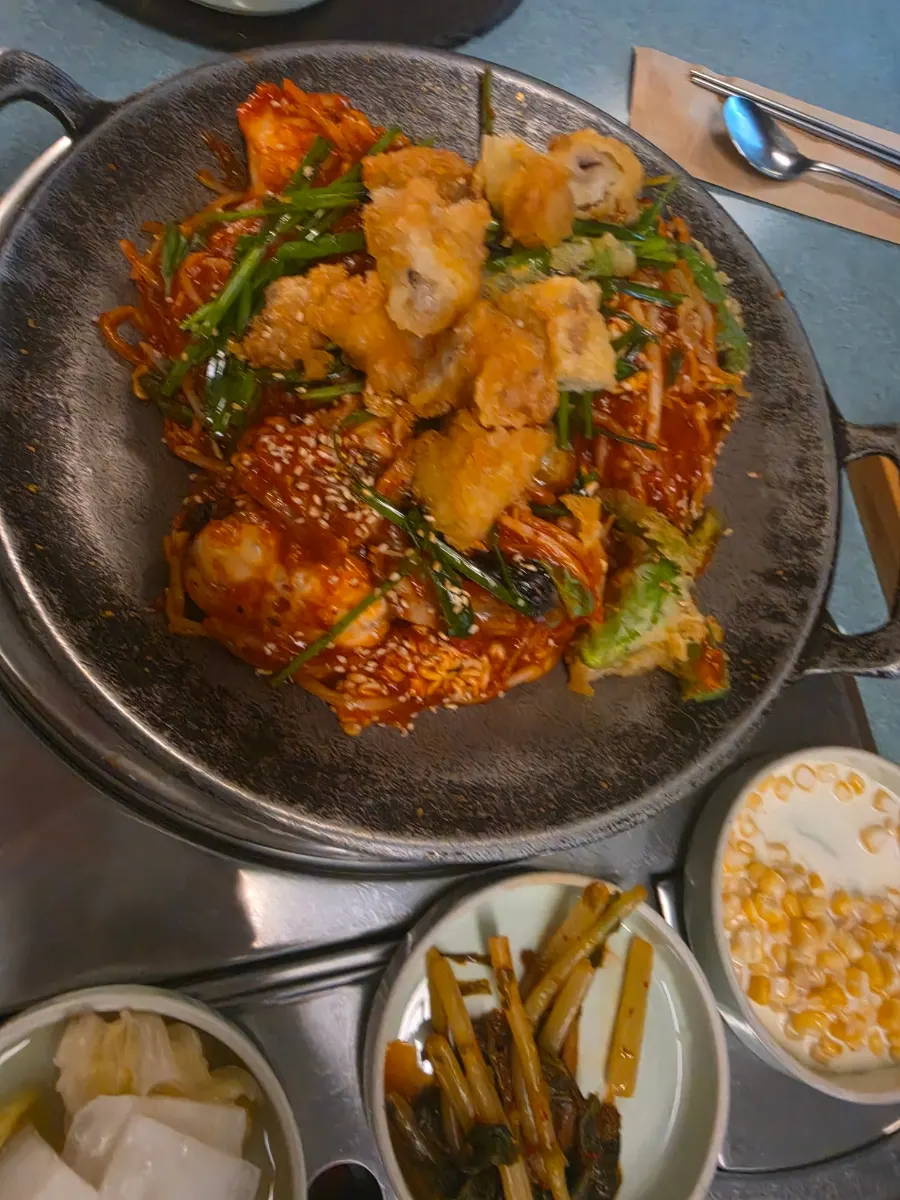 Agu-jjim topped with fried tripe