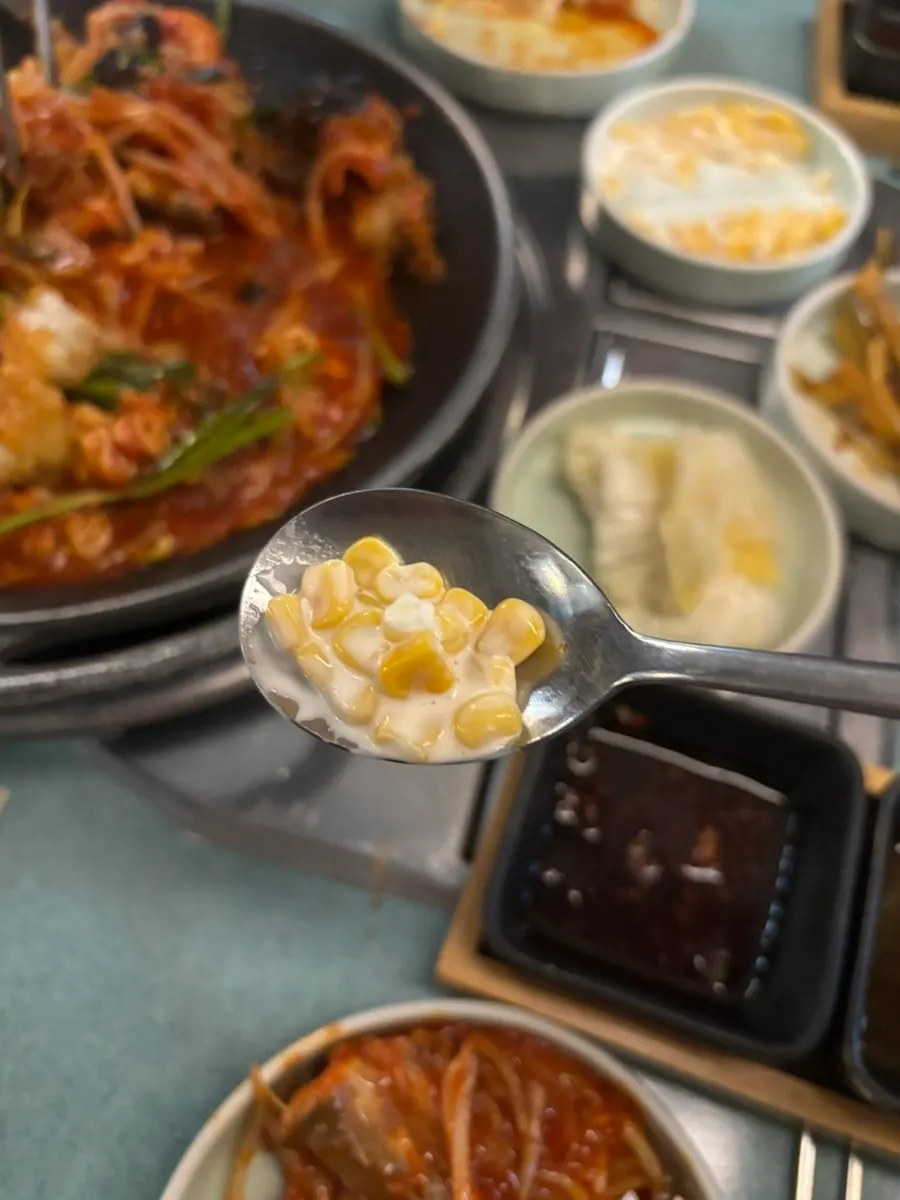 Agu-jjim served with corn salad