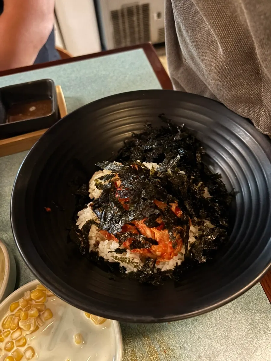 Final fried rice topped with crushed seaweed