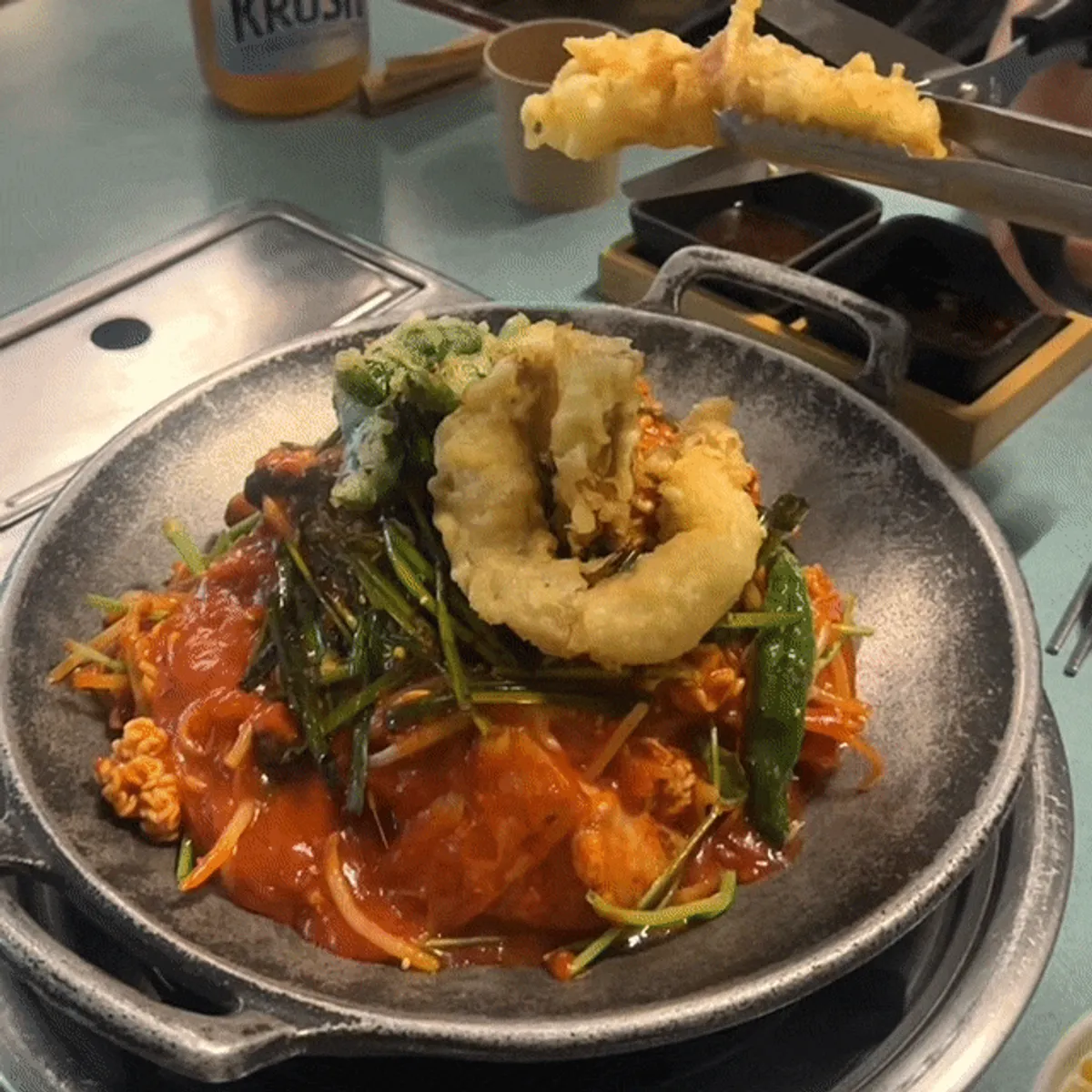 Signature photo of Seongsu AGU's agu-jjim topped with fried tripe