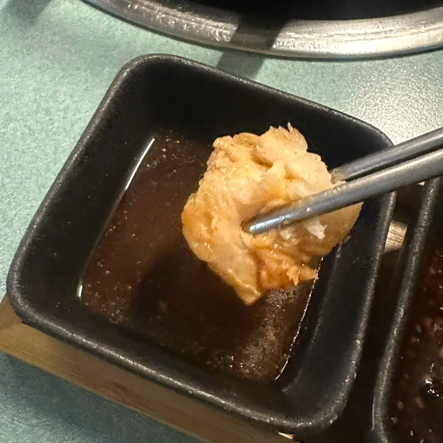 Plump monkfish meat dipped in sauce