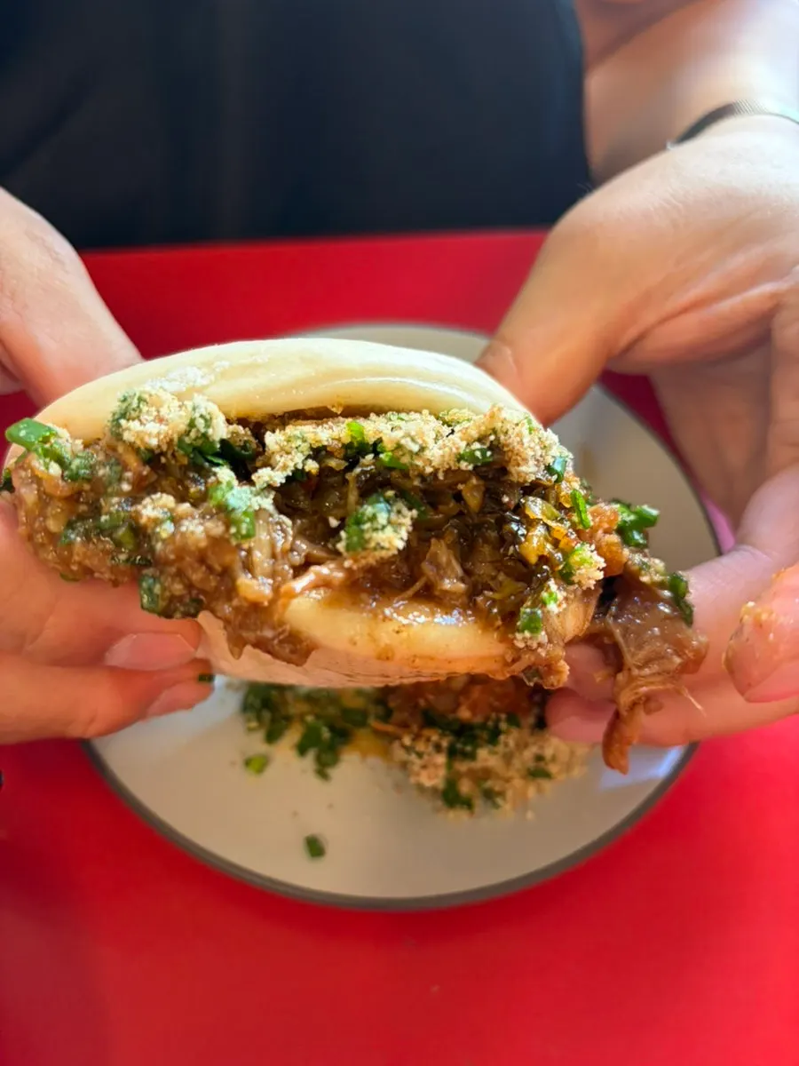 Classic bao filled with braised pork and peanut powder